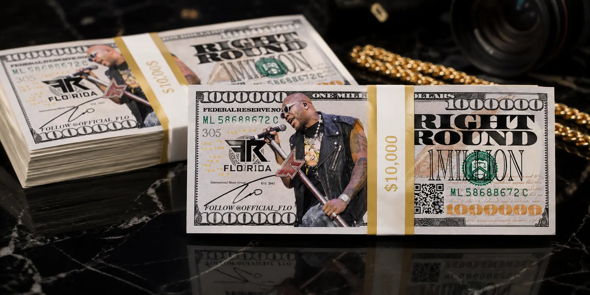 Custom Flo Rida million dollar prop money stacks produced by Prop Money Inc. for entertainment and media productions.